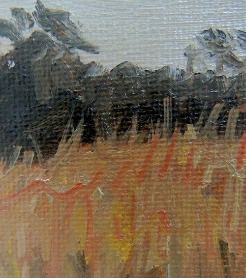 close up of brushstrokes in an original moody landscape painting